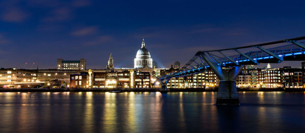 St paul's cathedral overlooking the millennium bridge and the river thames, london.
