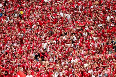 Group of people on red wall