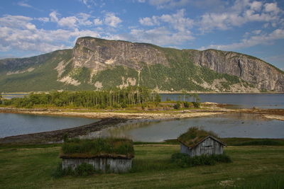 Scenic view of lake and mountains against sky