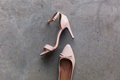 Low section of woman wearing high heels