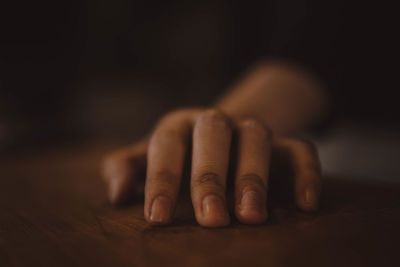 Close-up of hands on table