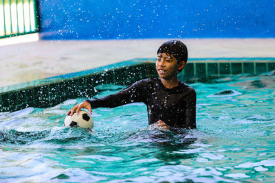 Young man in swimming pool