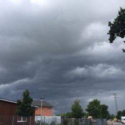 Low angle view of building against cloudy sky