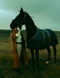 Horse standing on field