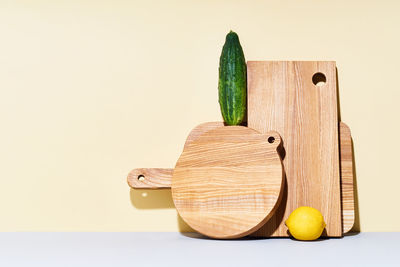 Wooden cutting boards of various shapes on bright studio background