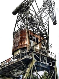 Low angle view of abandoned building against clear sky