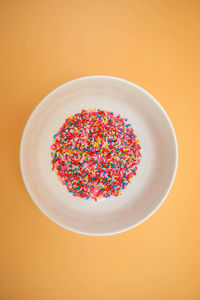 Directly above shot of multi colored cake on table
