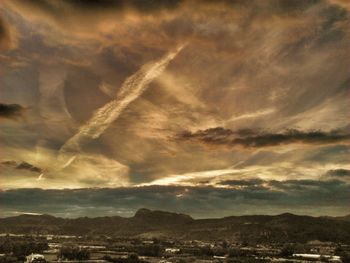 Scenic view of landscape against cloudy sky