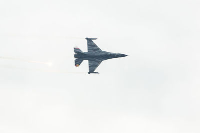 Low angle view of airplane flying in sky