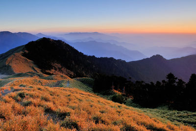 Scenic view of mountains against sky during sunset