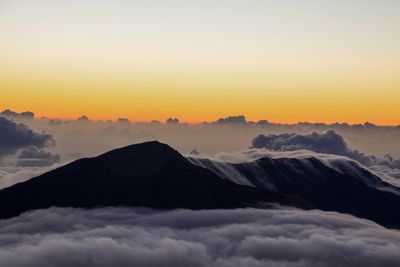 Scenic view of mountains against sky during sunset