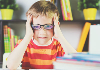 Portrait of boy with book