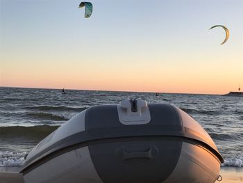 View of boat in sea at sunset