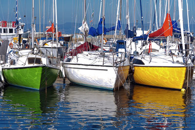 Fishing boats moored at harbor