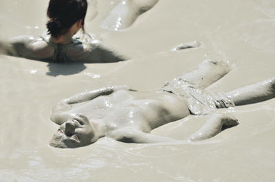 High angle view of people in mud