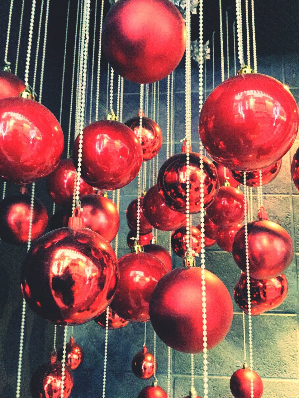 indoors, red, hanging, still life, decoration, celebration, in a row, christmas, large group of objects, close-up, variation, tradition, table, decor, lighting equipment, cultures, low angle view, illuminated, no people, lantern
