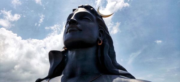 Low angle view of statue against sky