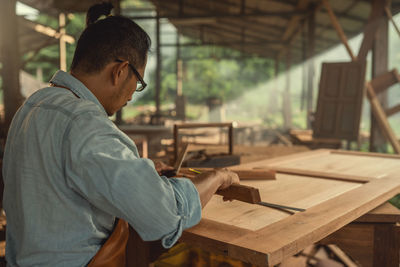 Carpenter working at workshop