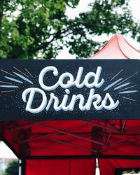 Low angle view of cold drinks text on banner