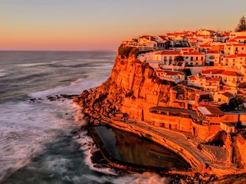 Aerial view of sea during sunset