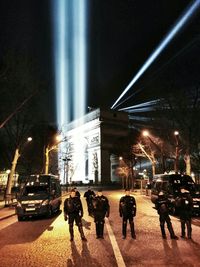 People walking on street at night