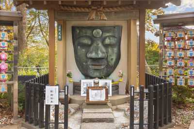 Statue against historic building