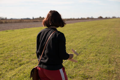 Rear view of woman walking on land