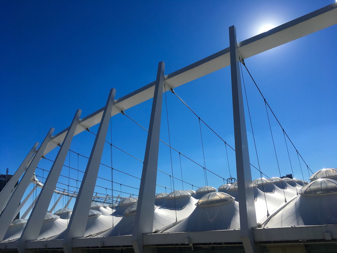 day, built structure, architecture, blue, outdoors, low angle view, bridge - man made structure, no people, clear sky, sky, building exterior