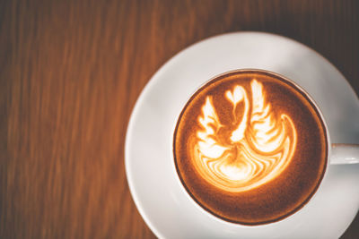 Close-up of cappuccino on table