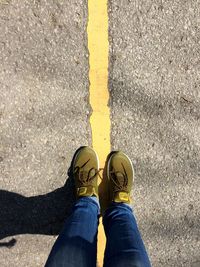 Low section of man standing on ground