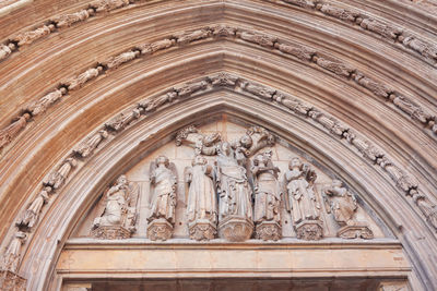 Cathedral portal with sculptures . entrance ornamental of valencia cathedral