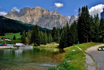 Scenic view of lake and mountains against sky