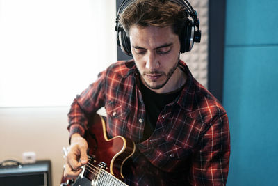 Young man playing guitar