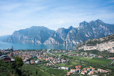 High angle view of townscape and mountains against sky