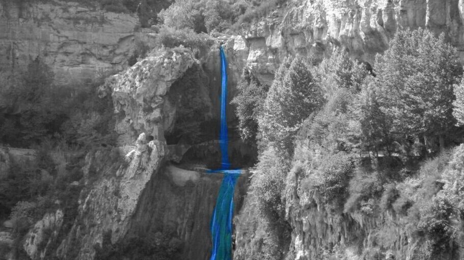 tree, nature, rock - object, blue, rock formation, rope, day, tree trunk, beauty in nature, tranquility, outdoors, mountain, hanging, low angle view, water, rock, close-up, forest, sunlight, rough