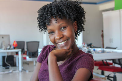 Portrait of smiling young woman at home