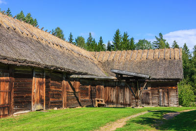 Old barn with thatched roof in the countryside