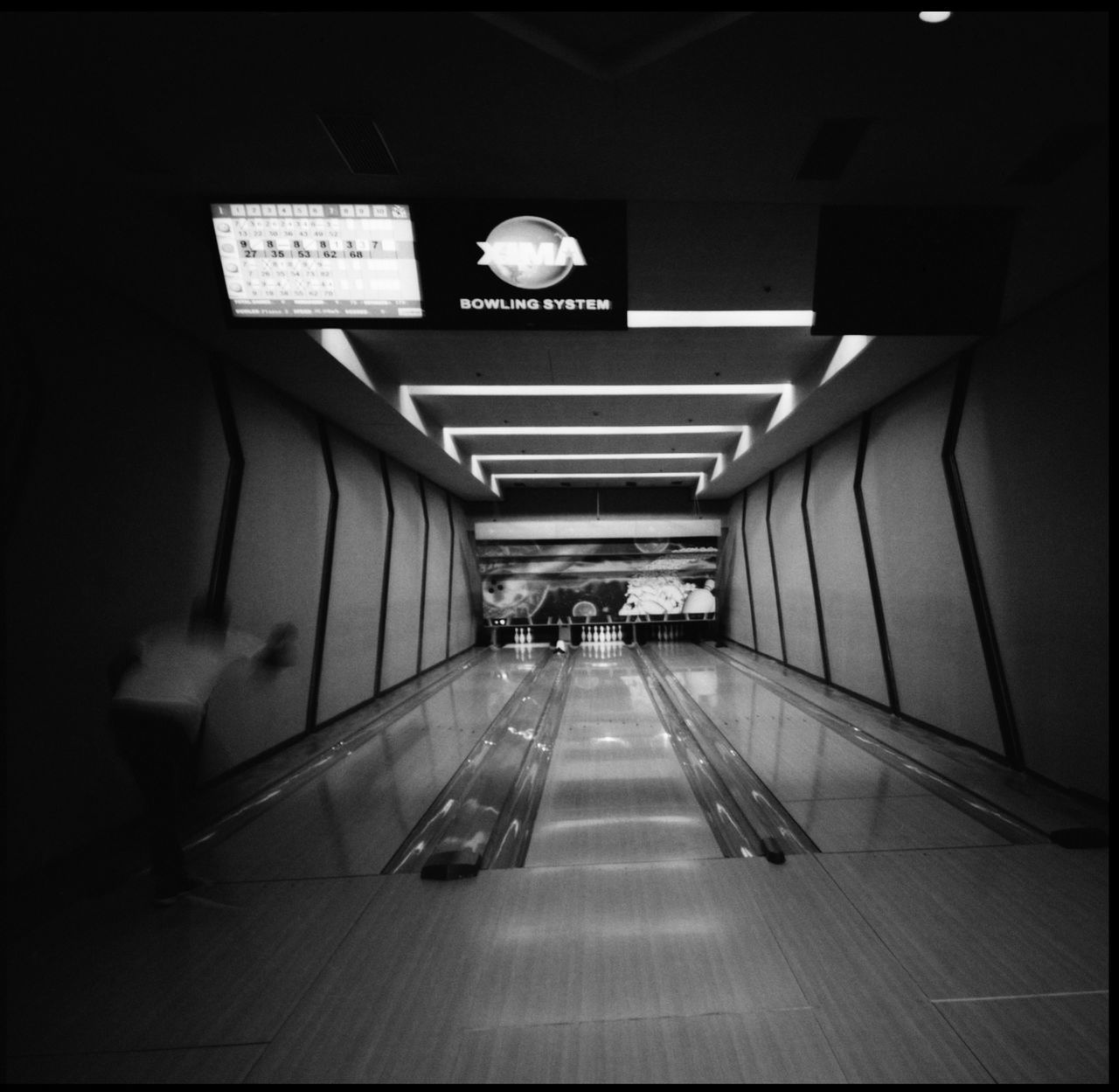 Bowling in Pyongyang Bowling Yanggakdo Hotel Yanggakdo Hotel Bowling In Pyongyang Pyongyang North Korea Architecture Pyongyang Indoors Bell On The Roof Little Bell Bowling Pins Black And White Bowling Film Photography 120 Mm Northkorean Roofs Northkorean Mountains Bowling Fire Chinese Roofs Black And White Photography Bowling Lane No People