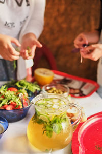 Midsection of woman preparing food