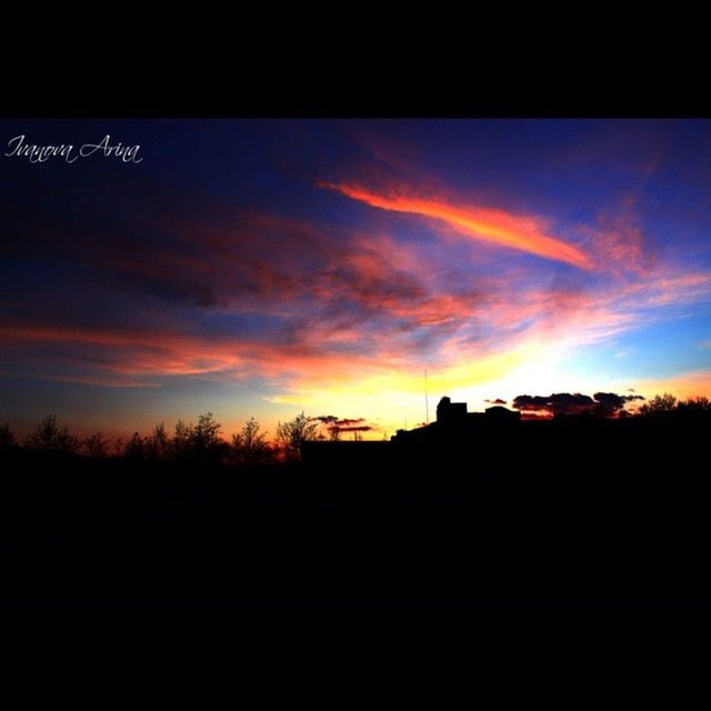 sunset, silhouette, building exterior, architecture, built structure, sky, orange color, house, tree, cloud - sky, dark, beauty in nature, scenics, residential structure, cloud, low angle view, nature, outdoors, no people, tranquility