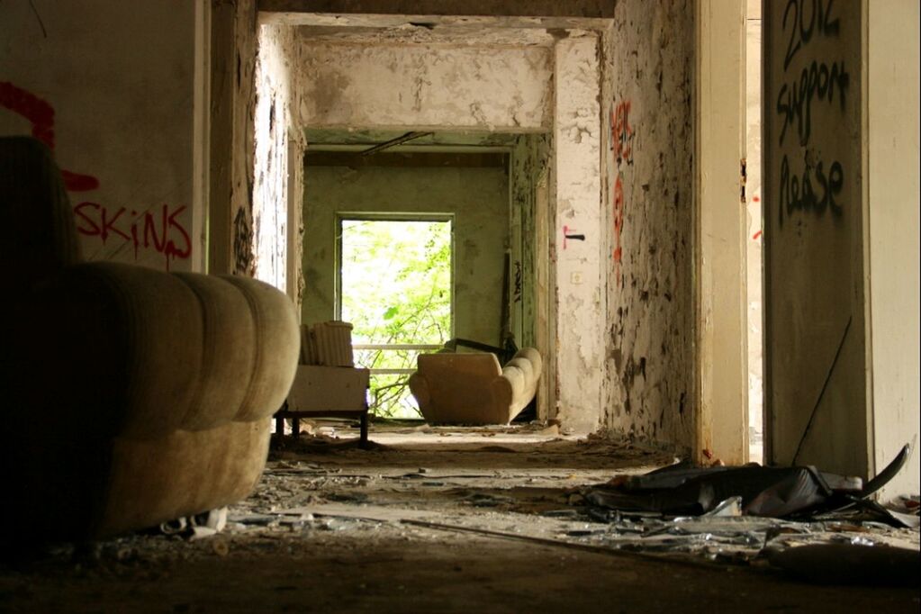 indoors, abandoned, built structure, architecture, house, window, door, messy, damaged, home interior, obsolete, chair, relaxation, absence, domestic animals, empty, mammal, day, animal themes, sunlight