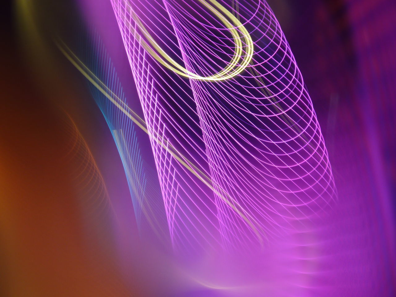 CLOSE-UP OF LIGHT PAINTING ON PURPLE BACKGROUND