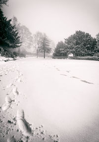 Scenic view of snow field against clear sky