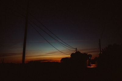 Silhouette landscape against sky during sunset