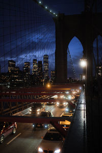 Illuminated bridge at night