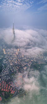 Aerial view of cityscape against sky