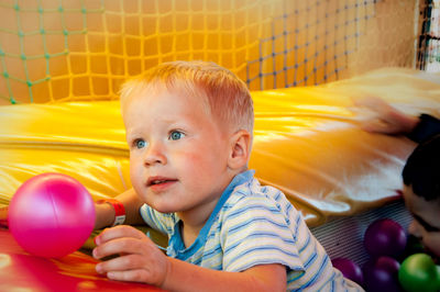 Portrait of cute boy with balloons