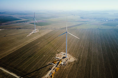 Construction site near windmill turbine, wind generator installing