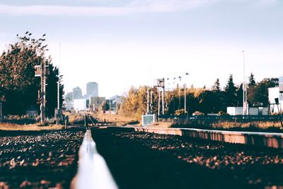 Surface level of railroad tracks against sky