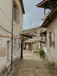 Narrow alley amidst old buildings in town